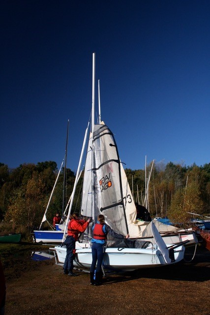Two people rigging a dinghy