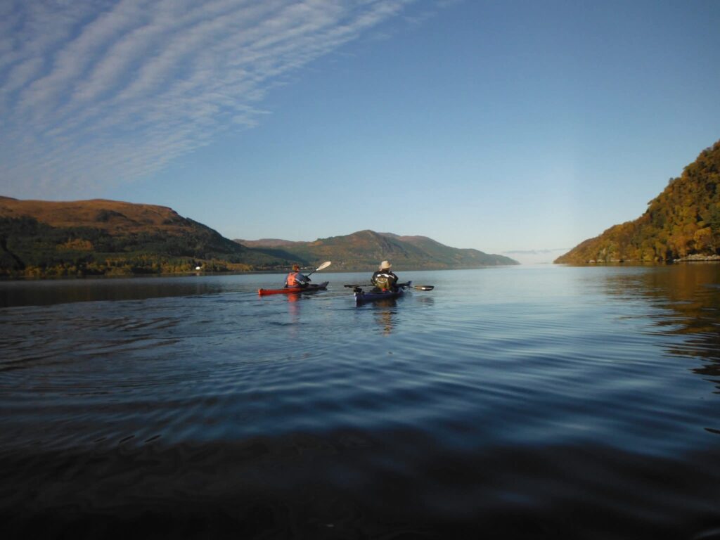 Two people canoeing on a lake